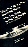 A book cover with a black background and white type in, probably, Helvetica. All the text is at an angle. There's also a stretched black-and-white photo of a face, possibly smiling.